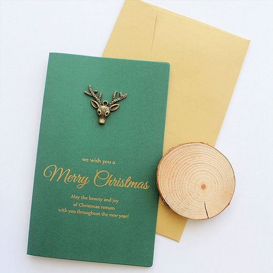 Pocztówka świąteczna z metalowym jeleniem